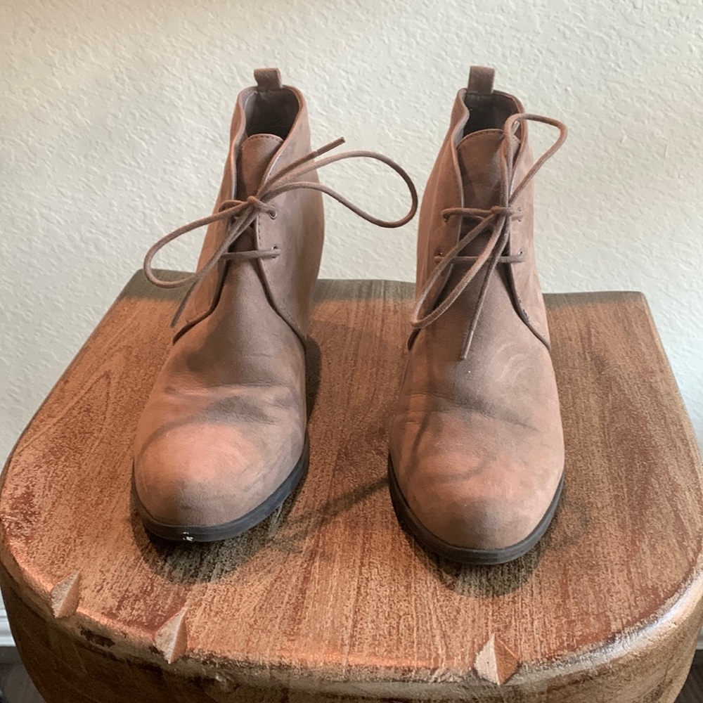 Brown wedge booties.